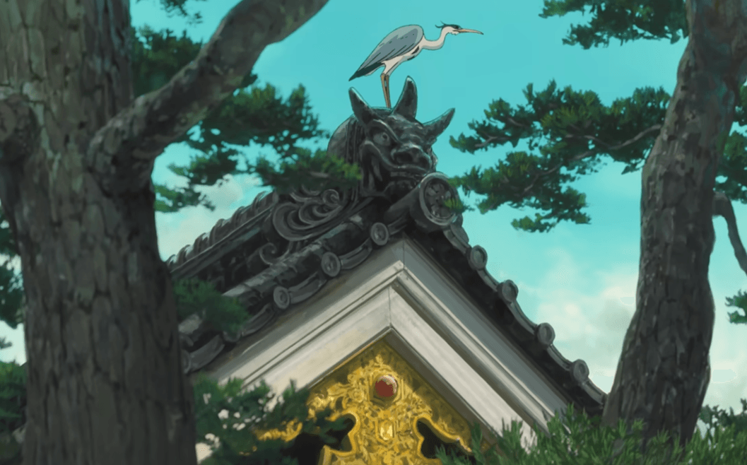 The grey heron standing on top of a temple looking down in The Boy and the Heron, Studio Ghibli 2023