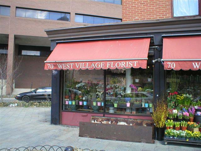 70 Greenwich Avenue ("West Village Florist") at the intersection of West 11th Street, southeast corner, just east of Seventh Avenue.