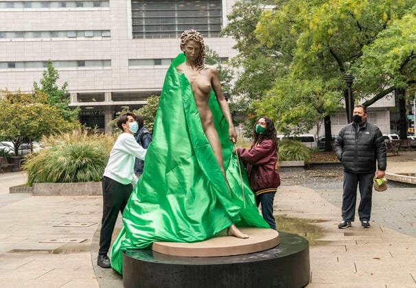 Medusa With The Head unveiling sculpture in NYC Miles Donnell and Bek Andersen help to unveil Medusa With The Head of P