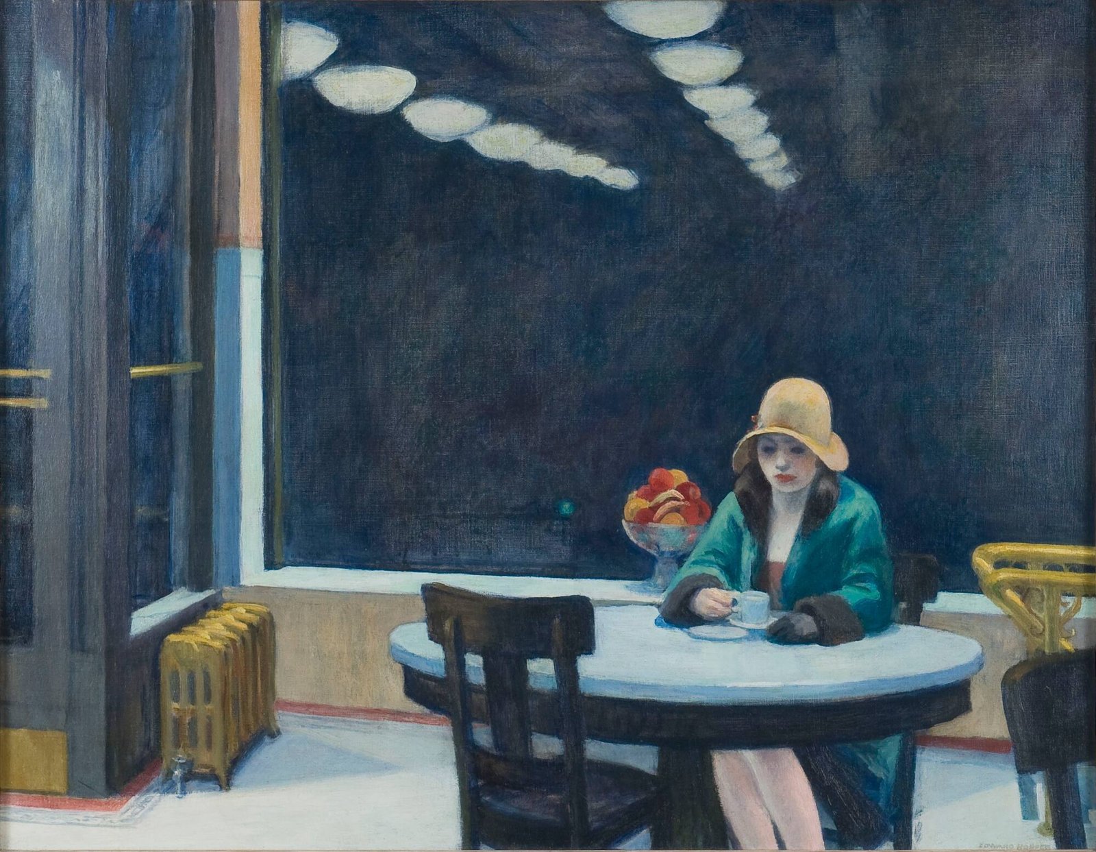 A young woman in a coat and hat sits alone at a small round table at night, looking down into a cup of coffee, with a dark window reflecting rows of lights behind her.