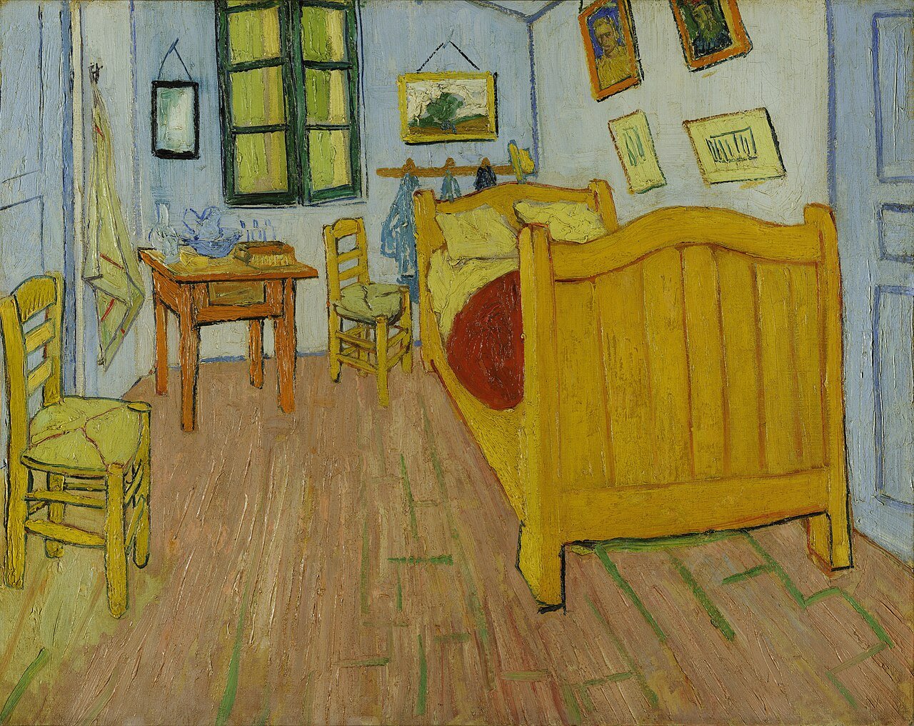 Vincent van Gogh painting of his empty bedroom in Arles with a wooden bed, two chairs, a small table, and pictures on pale blue walls